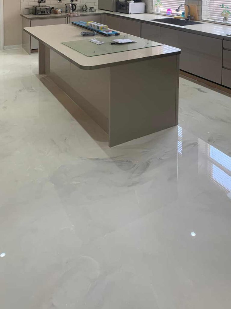Light metallic epoxy floor in a contemporary interior